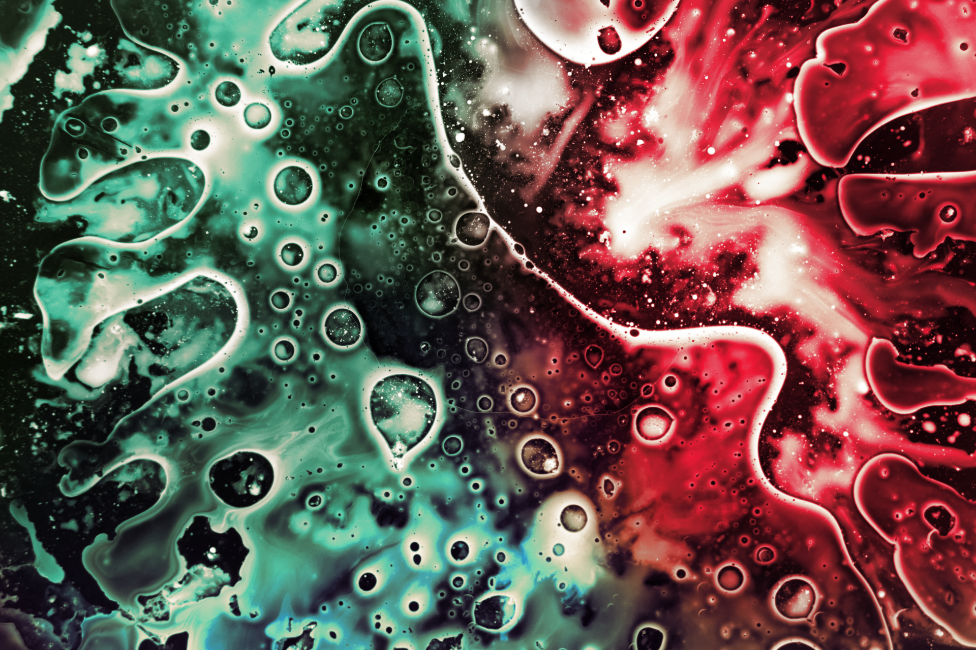 Green and red abstract painting with bubbles